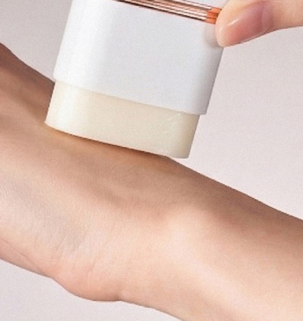 KAHI Airy Fit Sun Stick gliding over the forearm