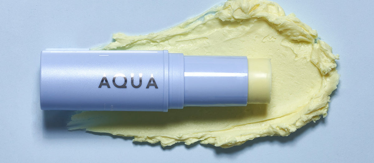 KAHI Aqua Balm stick on a swatch of its light, silky balm