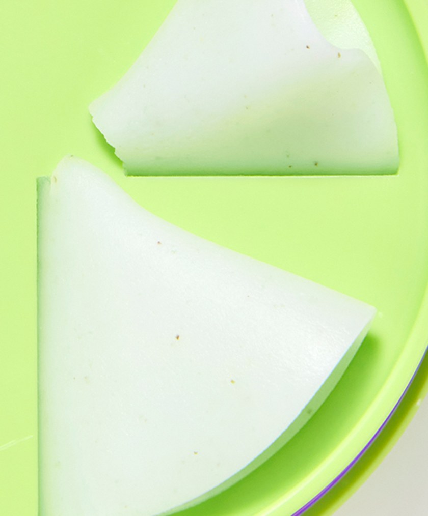 Shaved curls of KAHI Cleansing Balm Pore Control (Mung Bean) in the twist-up jar