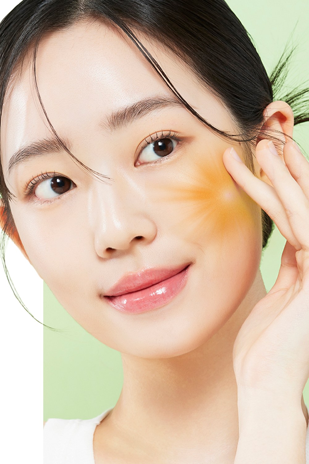 Woman massaging KAHI Heat Deep Cleansing Oil into her cheek